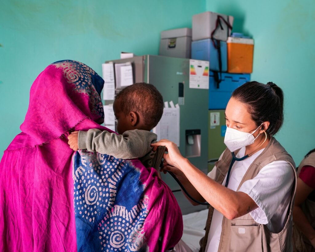 A photograph of a child receiving care at a therapeutic feeding centre in West Africa, MSF child malnutrition Nigeria , Global Mental Health Treatment Gap by Region